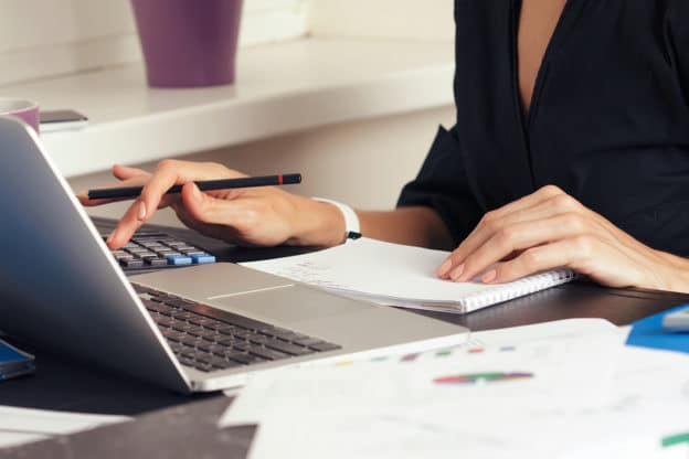 Close up view of bookkeeper or financial inspector hands making report calculating or checking balance. Home finances investment economy saving money or insurance concept