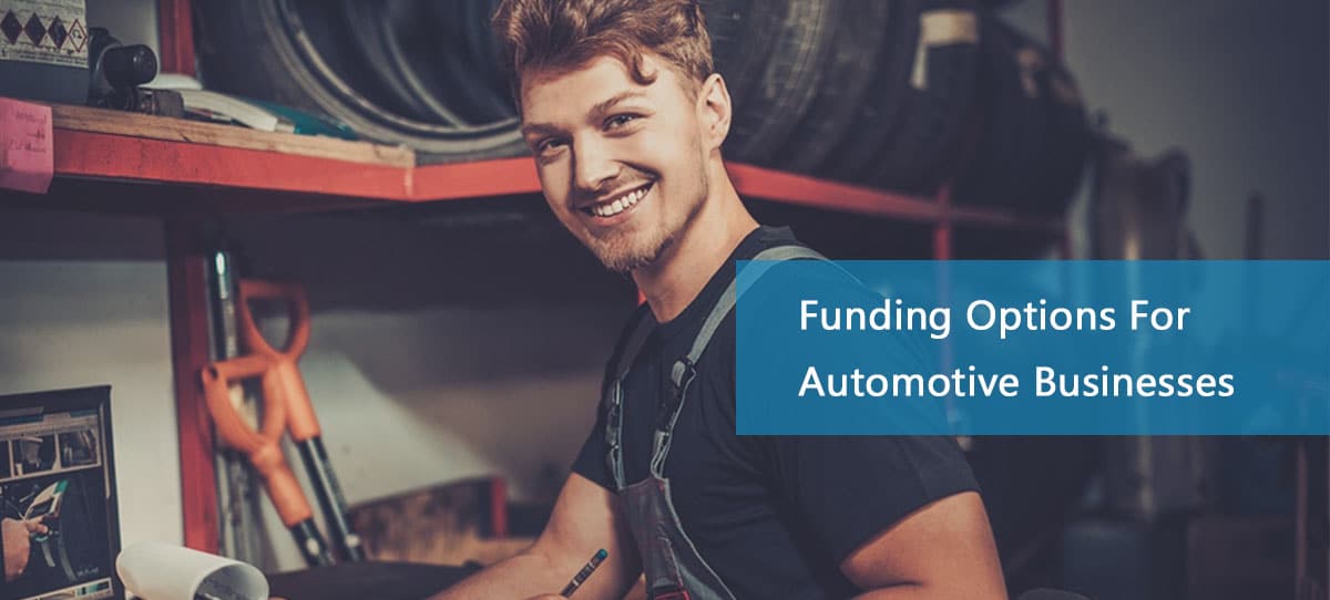 Smiling automotive working in business thanks to an automotive business loan