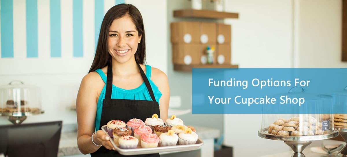 Business owner show display of cupcakes , in business due to cupcake shop financing