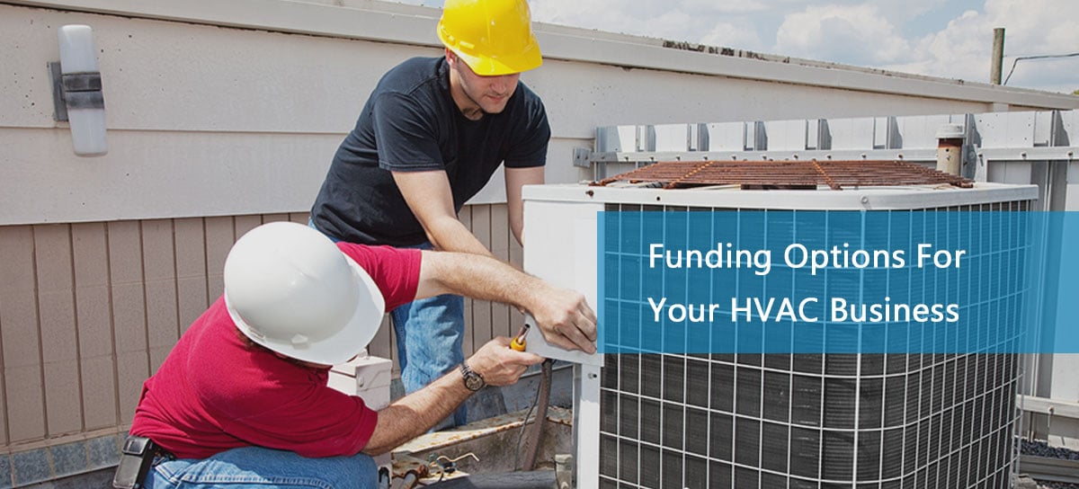 Two men working on air conditioning unit thanks to hvac commercial business financing