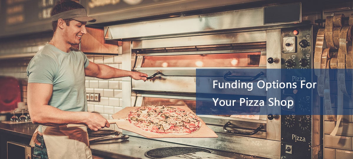 Man putting pizza in new oven financing due to a pizza shop loan